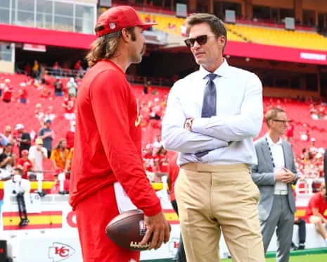 The NFL legend ignites social media outrage following being spotted in Raiders coaching booth